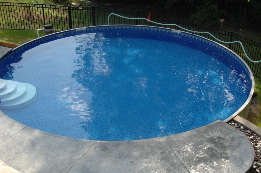 Above ground pool project showing integration with landscape and deck zones